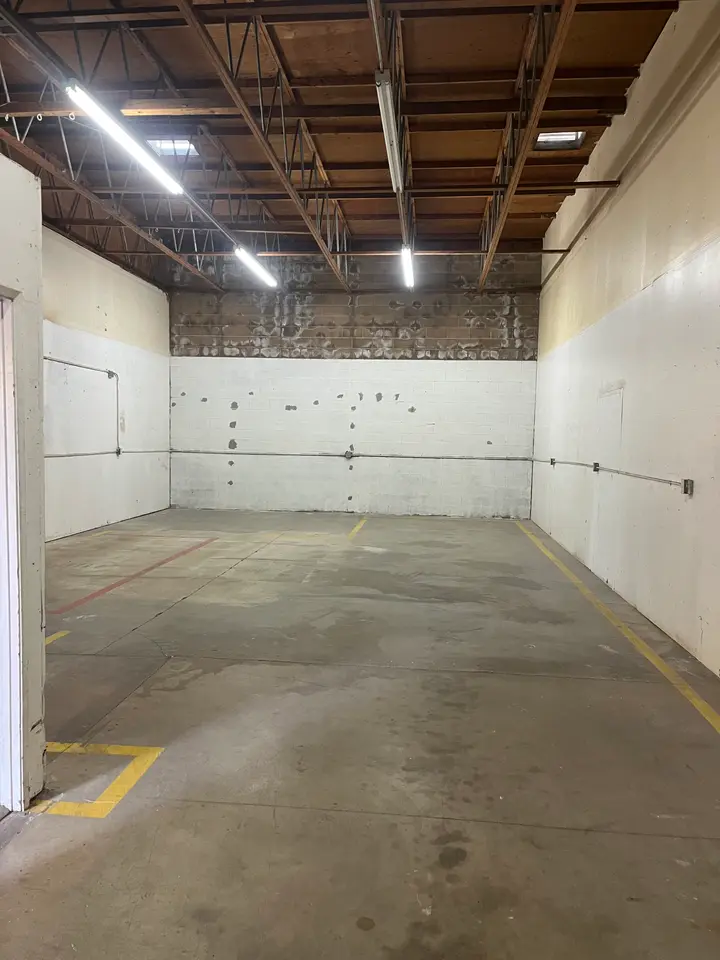 The same warehouse bay emptied and swept